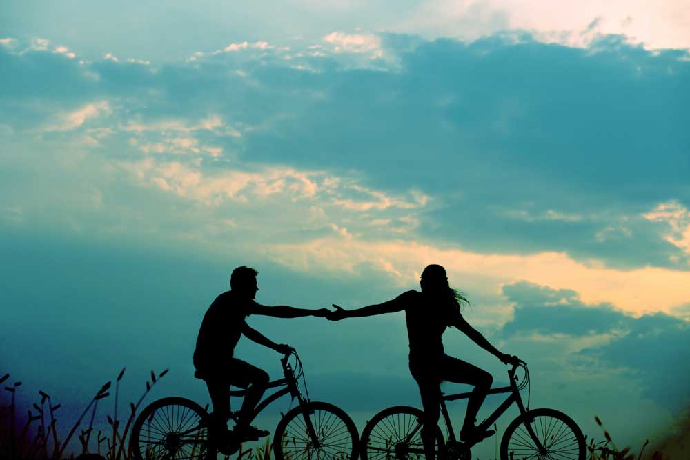 two people riding bikes